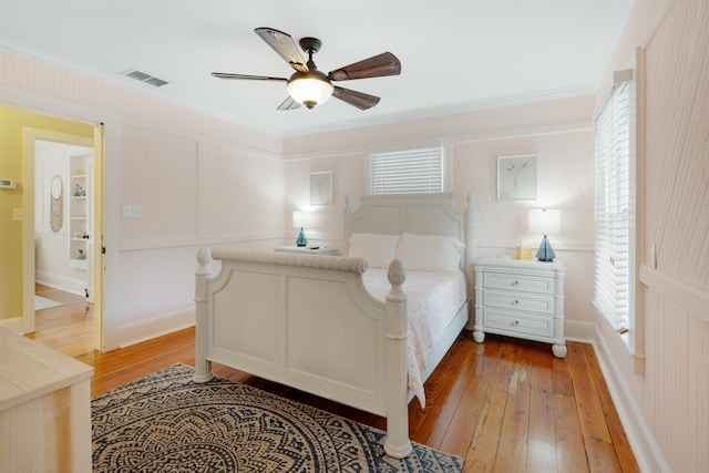 15 Rohde Ave, Saint Augustine, FL 32084 - bedroom with light wood-style flooring, crown molding, a decorative wall, and ceiling fan