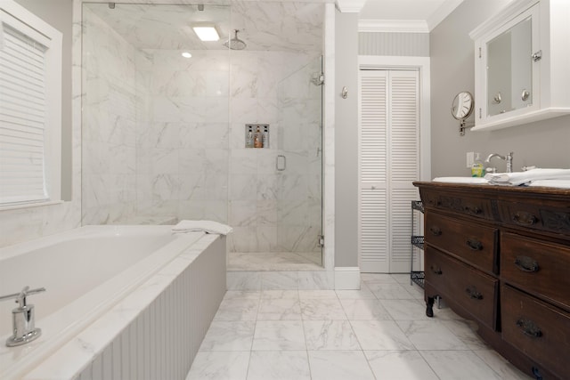 bathroom featuring crown molding, vanity, and independent shower and bath