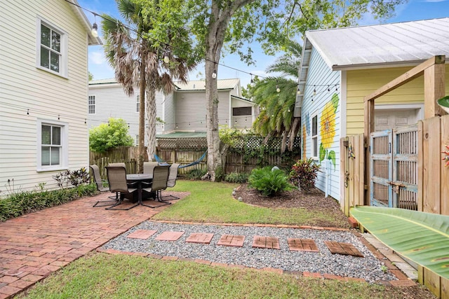 15 Rohde Ave, Saint Augustine, FL 32084 - fenced backyard featuring a gate and a patio area