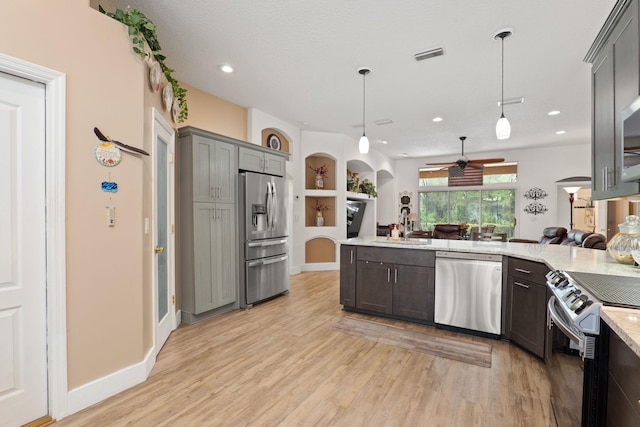 1300 Paradise Pond Rd, Saint Augustine, FL 32092 - kitchen featuring stainless steel appliances, open floor plan, ceiling fan, light wood finished floors, and recessed lighting