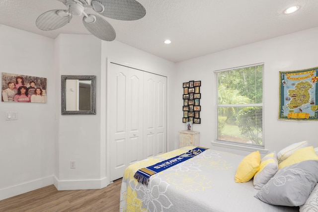 1300 Paradise Pond Rd, Saint Augustine, FL 32092 - bedroom featuring wood finished floors, baseboards, a closet, recessed lighting, and ceiling fan