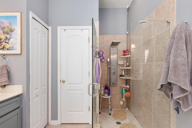 1300 Paradise Pond Rd, Saint Augustine, FL 32092 - bathroom with a stall shower, vanity, a closet, and tile patterned floors