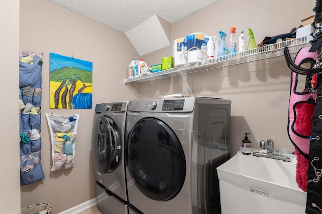 1300 Paradise Pond Rd, Saint Augustine, FL 32092 - laundry room with washing machine and dryer, baseboards, and a textured ceiling