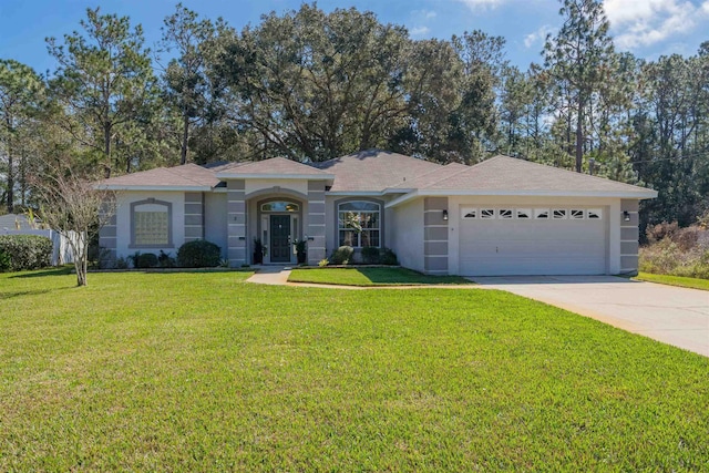 view of front facade with a garage, concrete driveway, a front lawn, and stucco siding