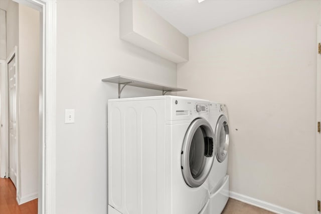 laundry area featuring washer and clothes dryer