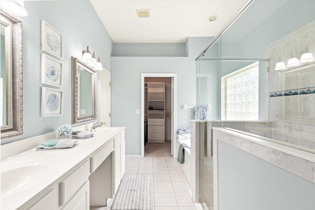 bathroom with separate shower and tub, tile patterned floors, and vanity