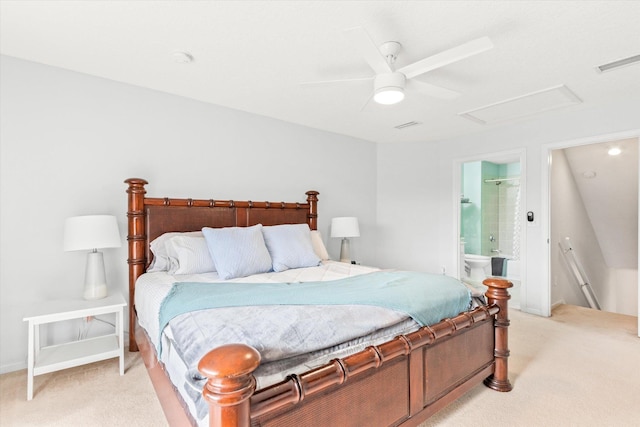 carpeted bedroom featuring ceiling fan and ensuite bath