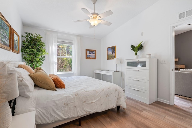 bedroom with ceiling fan and light wood-type flooring