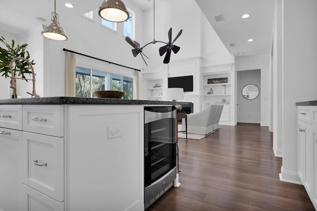 200 Manuel Ct, Saint Augustine, FL 32095 - kitchen with white cabinetry, plenty of natural light, beverage cooler, and visible vents