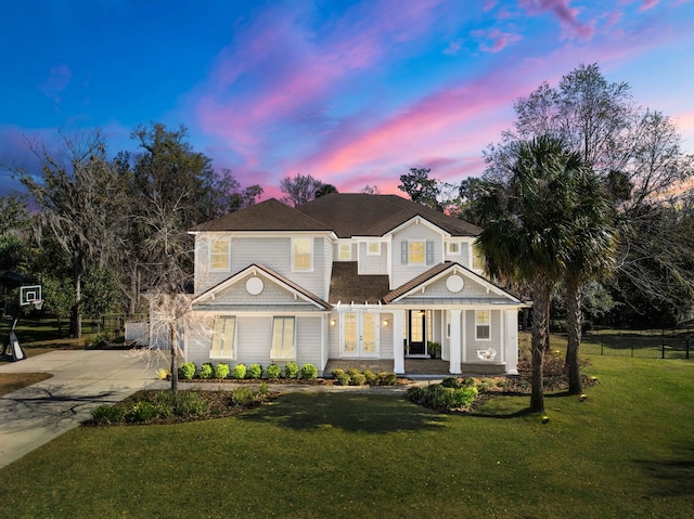 200 Manuel Ct, Saint Augustine, FL 32095 - view of front of home with a porch, concrete driveway, a yard, and fence