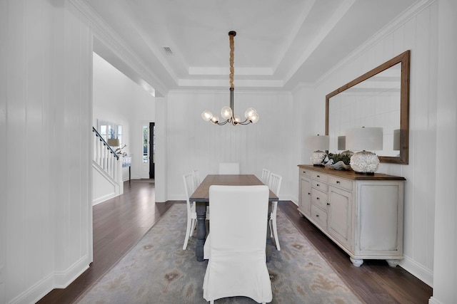 200 Manuel Ct, Saint Augustine, FL 32095 - dining area featuring visible vents, dark wood finished floors, stairs, a raised ceiling, and a notable chandelier