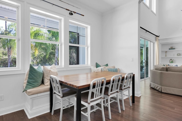 200 Manuel Ct, Saint Augustine, FL 32095 - dining space with baseboards, wood finished floors, and crown molding