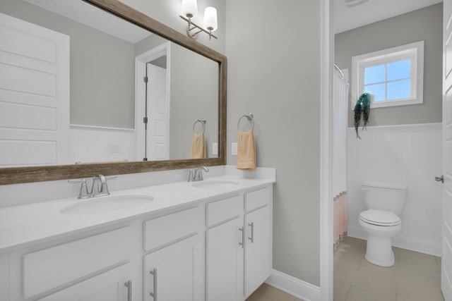 200 Manuel Ct, Saint Augustine, FL 32095 - full bathroom featuring a sink, toilet, double vanity, and tile patterned floors