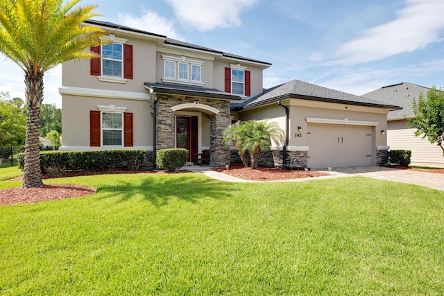 view of front of property with a front yard and a garage