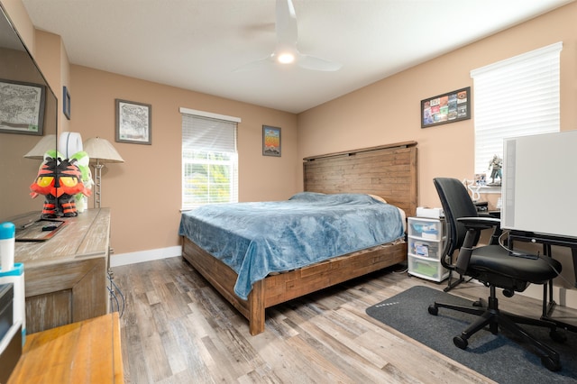 bedroom featuring hardwood / wood-style flooring and ceiling fan