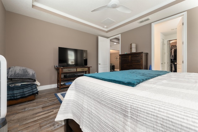 bedroom with ceiling fan and dark hardwood / wood-style floors