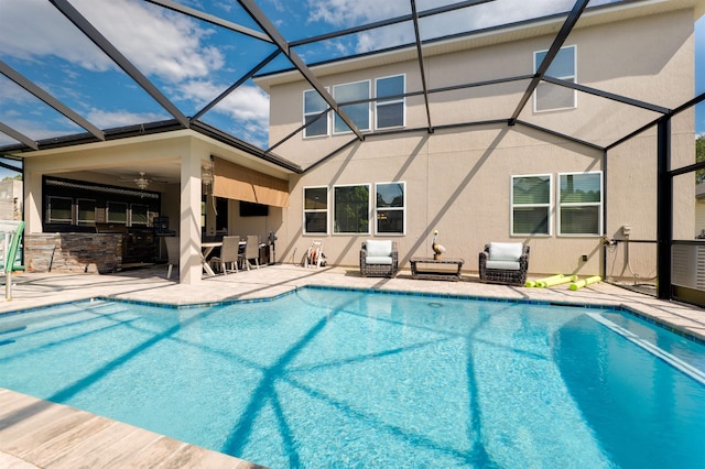 view of swimming pool featuring a patio and ceiling fan