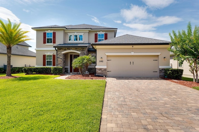 prairie-style home with a front yard and a garage