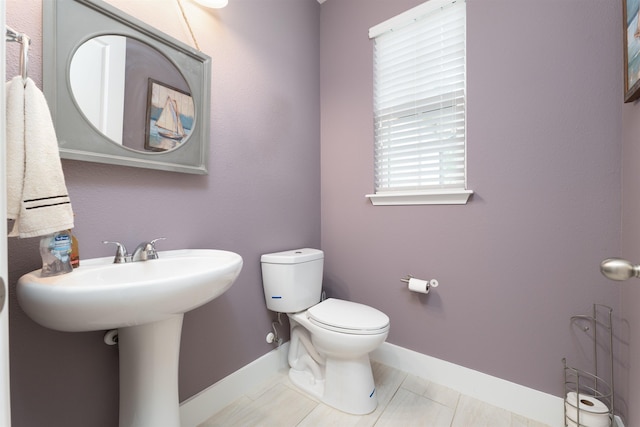 bathroom featuring tile patterned floors and toilet