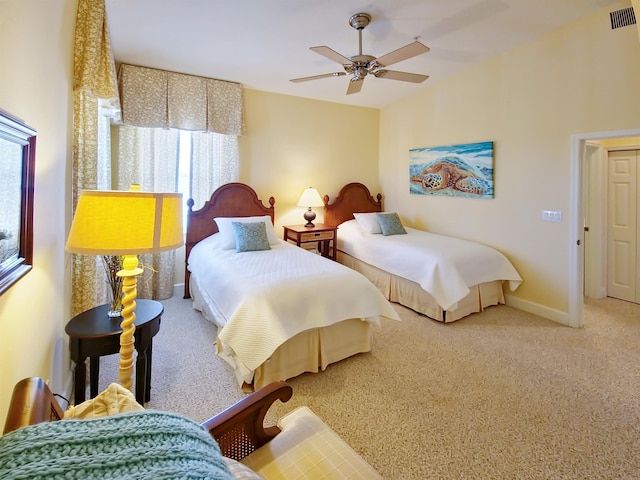 carpeted bedroom featuring ceiling fan and multiple windows