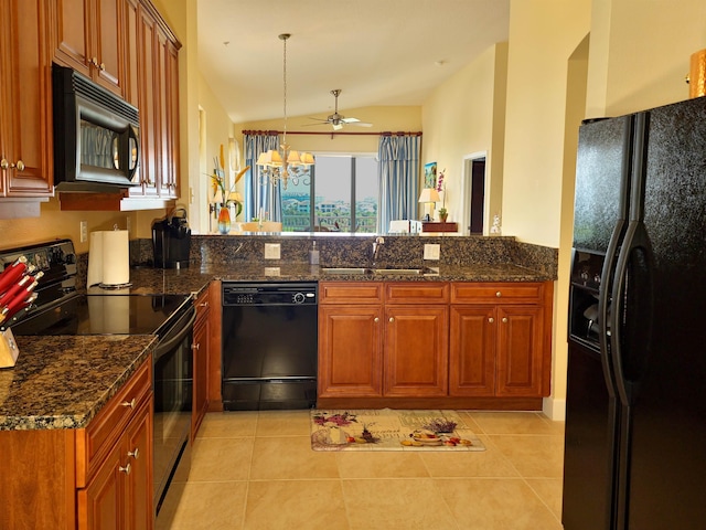 kitchen with ceiling fan with notable chandelier, sink, black appliances, light tile patterned floors, and lofted ceiling