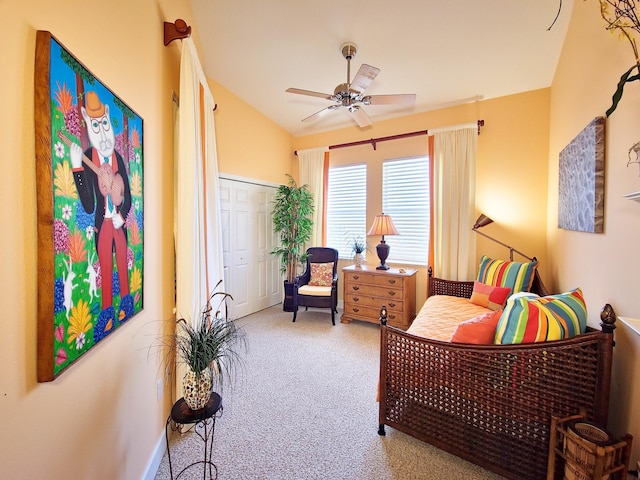 sitting room featuring ceiling fan, carpet, and lofted ceiling