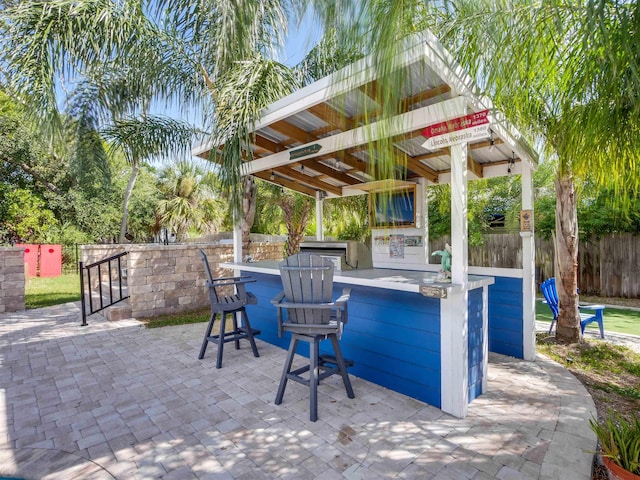 view of patio featuring exterior bar