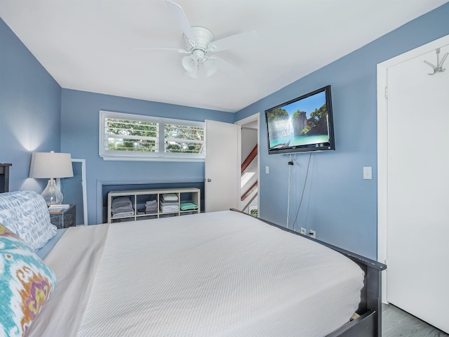 bedroom featuring hardwood / wood-style floors and ceiling fan