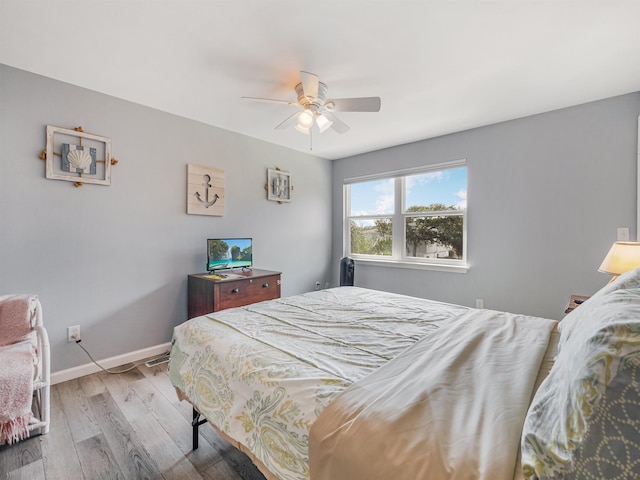 bedroom featuring light hardwood / wood-style flooring and ceiling fan