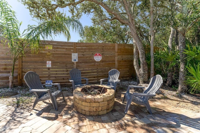 view of patio / terrace with an outdoor fire pit