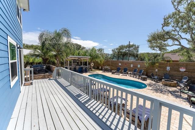 view of swimming pool featuring a patio area and an outdoor fire pit