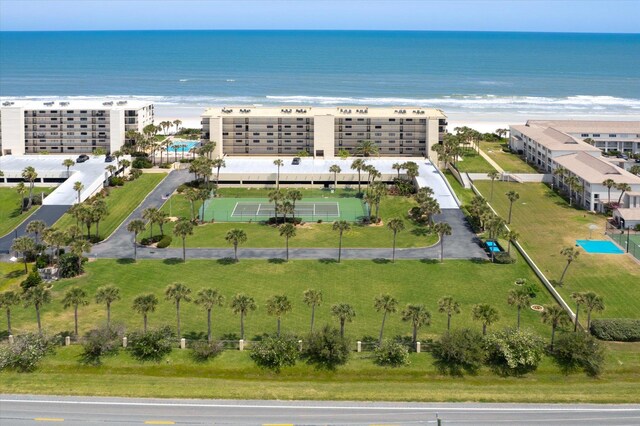 bird's eye view featuring a view of the beach and a water view