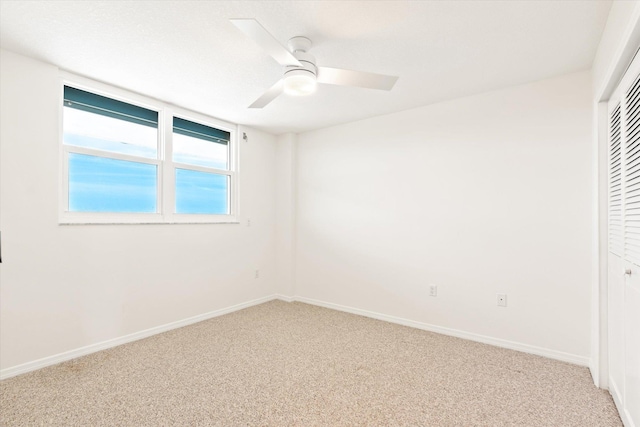 interior space featuring carpet flooring, a closet, and ceiling fan