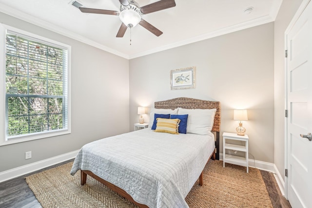4954 A1A, Saint Augustine, FL 32080 - bedroom with wood finished floors, multiple windows, baseboards, and ornamental molding