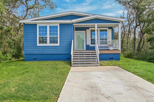4954 A1A, Saint Augustine, FL 32080 - view of front of property with crawl space, a porch, and a front lawn