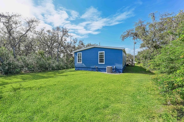 4954 A1A, Saint Augustine, FL 32080 - view of side of home featuring central air condition unit, a lawn, and crawl space