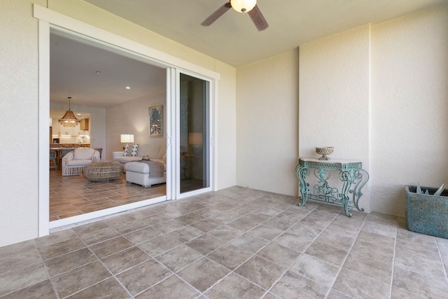 view of patio featuring ceiling fan