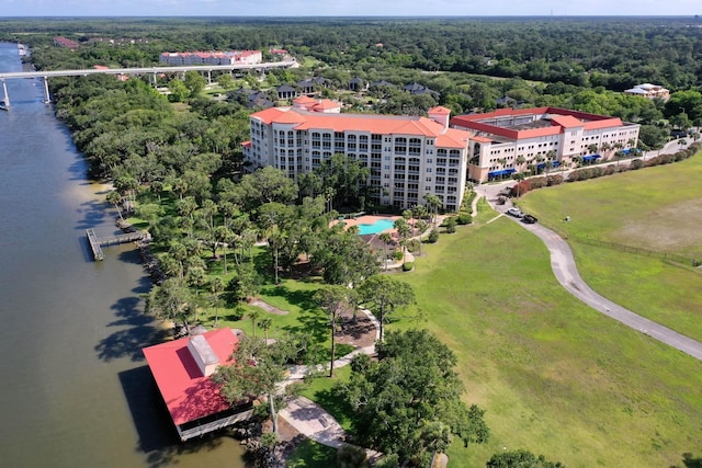 aerial view with a water view and a view of trees