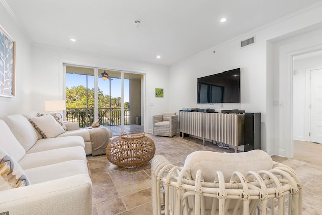 living room featuring ornamental molding, recessed lighting, visible vents, and baseboards