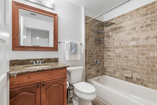 bathroom featuring bathing tub / shower combination, a textured ceiling, toilet, and vanity