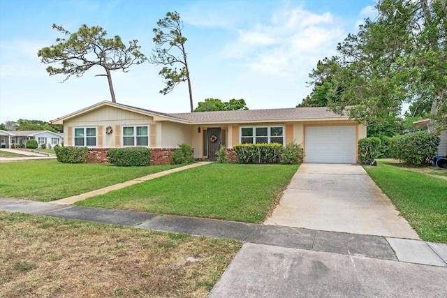 single story home with concrete driveway, a garage, and a front lawn