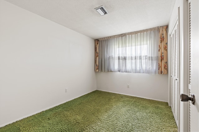 unfurnished room featuring carpet flooring and baseboards