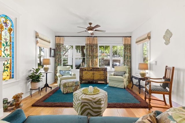 sunroom with a wealth of natural light and ceiling fan