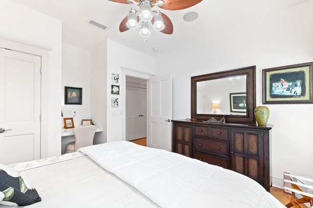 bedroom featuring ceiling fan and light hardwood / wood-style flooring