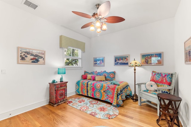 bedroom featuring hardwood / wood-style flooring and ceiling fan