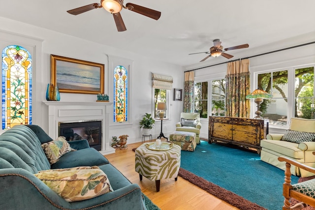 living room featuring hardwood / wood-style flooring and ceiling fan