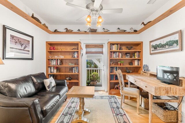 office area featuring light hardwood / wood-style flooring and ceiling fan