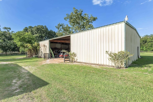 view of outbuilding featuring a lawn