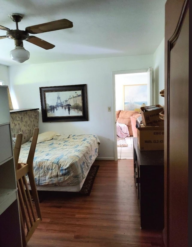 bedroom with ceiling fan and dark hardwood / wood-style flooring