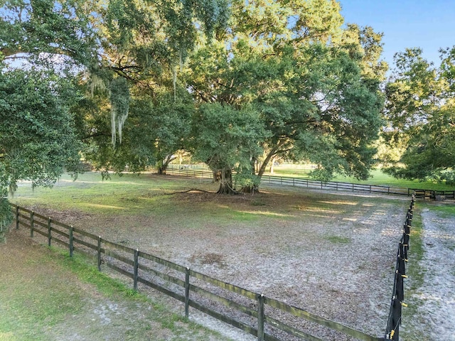 view of yard with a rural view